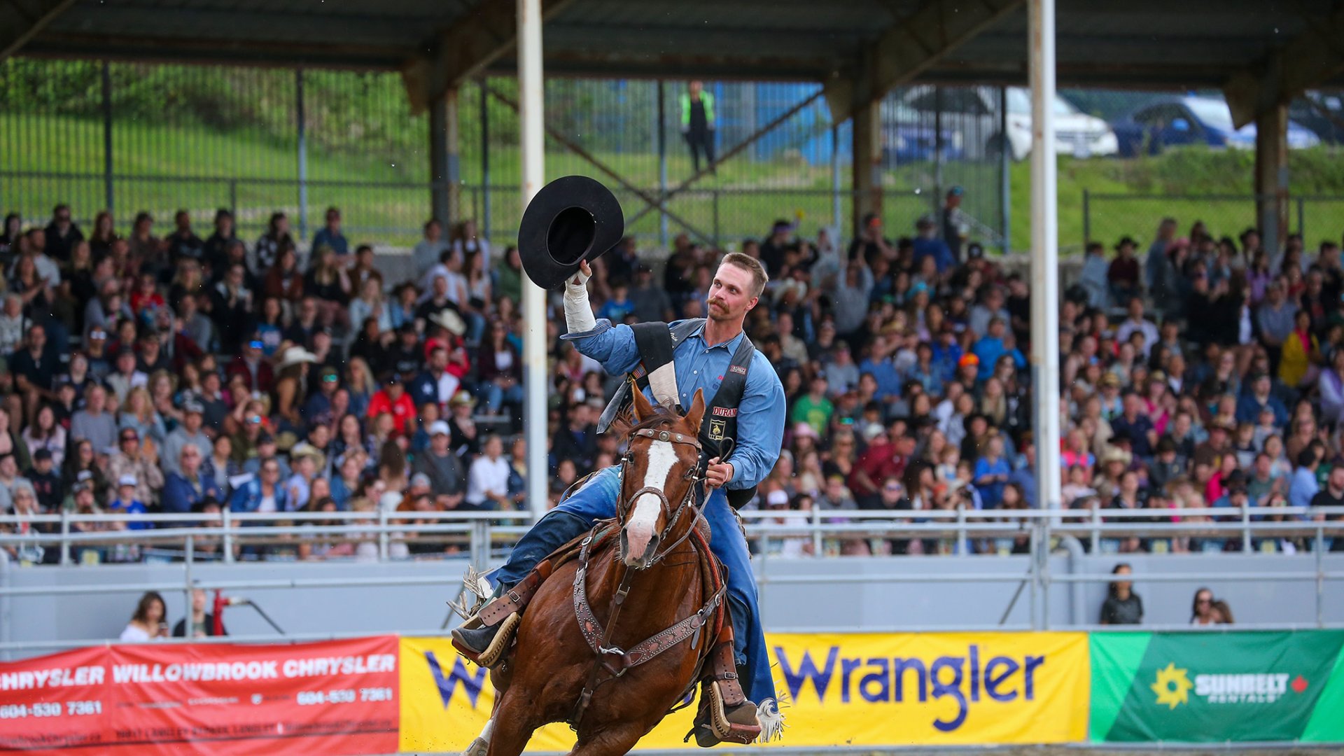 CRCF A Cowboy tips hit hat to the crowd at the Cloverdale Rodeo and Country Fair in Surrey BC CVR40846 49 Photo Credit Sean Libin