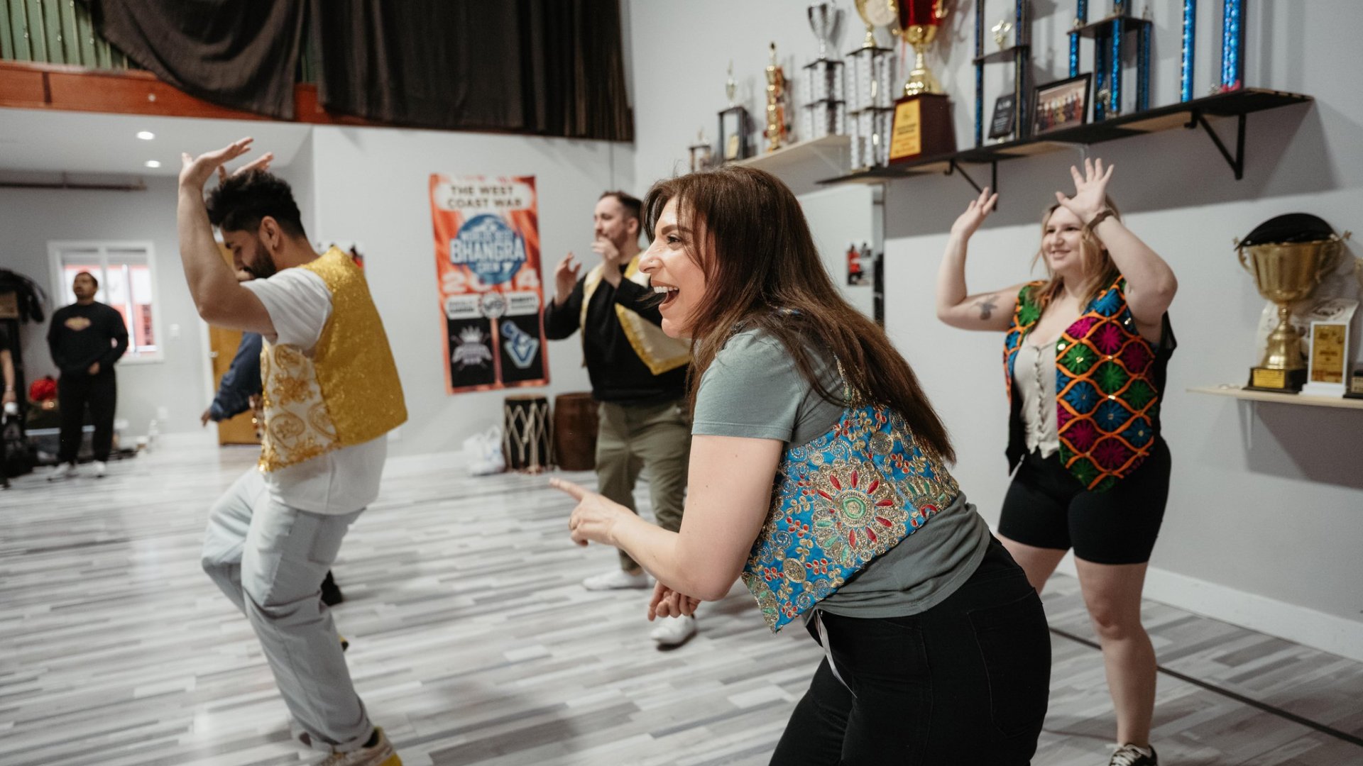 Bollywood Dance Experience Dancers laughing as they learn the choreography