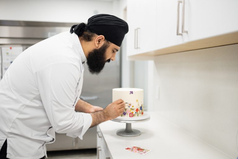 Jujhar intricately decorating a cake - Surrey Through My Lens - Jujhar Mann